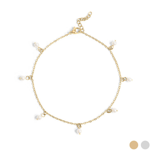 Gold anklet with evenly spaced pearls on a white background