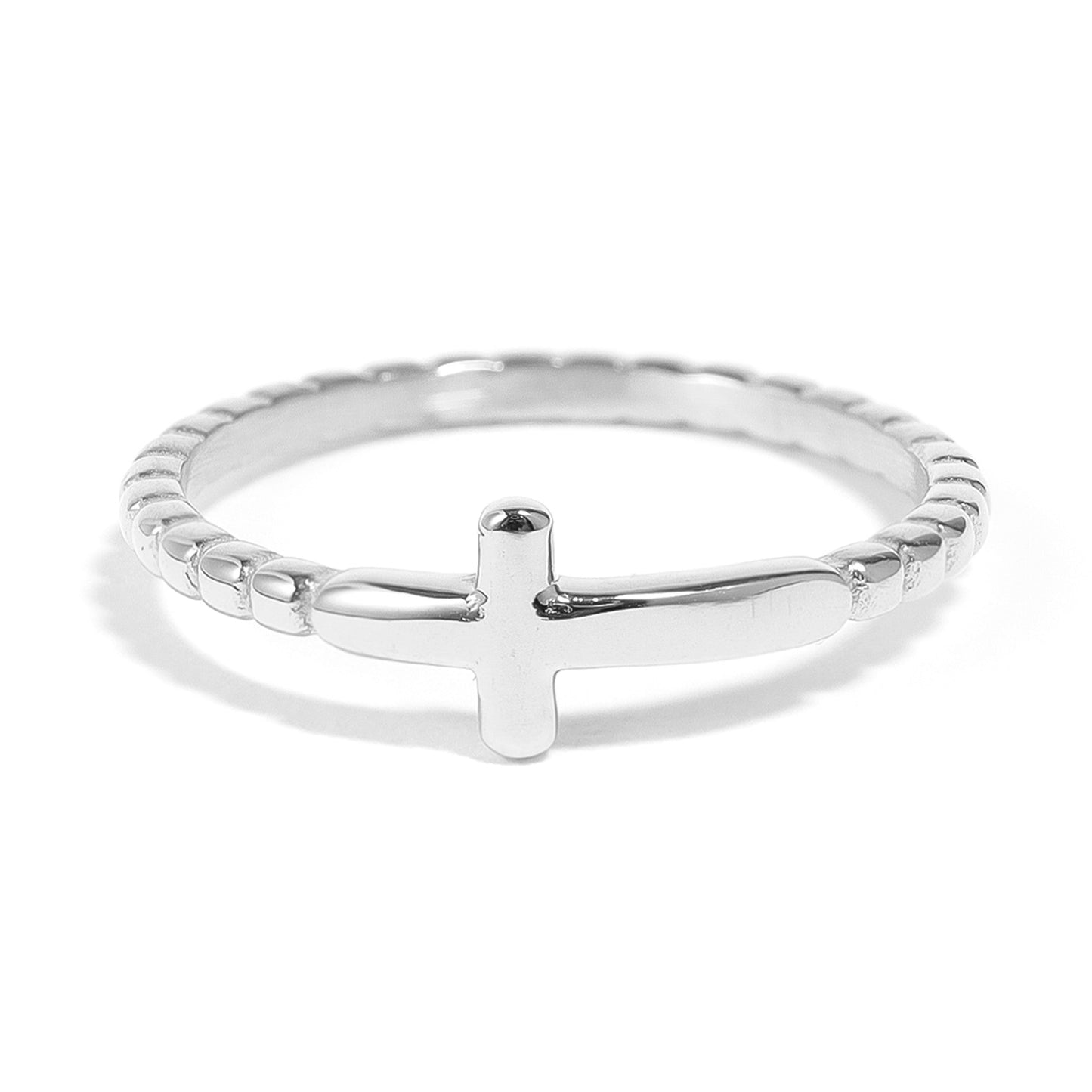 Silver ring with a cross design on a white background