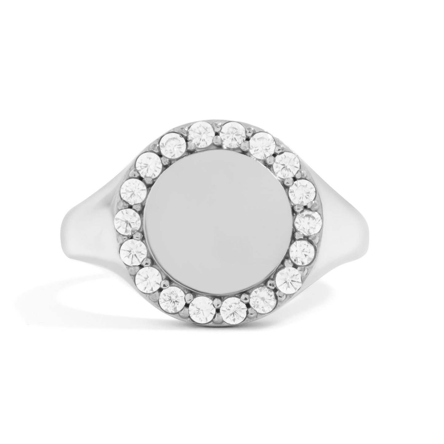 Silver circular signet ring with diamonds on a white background