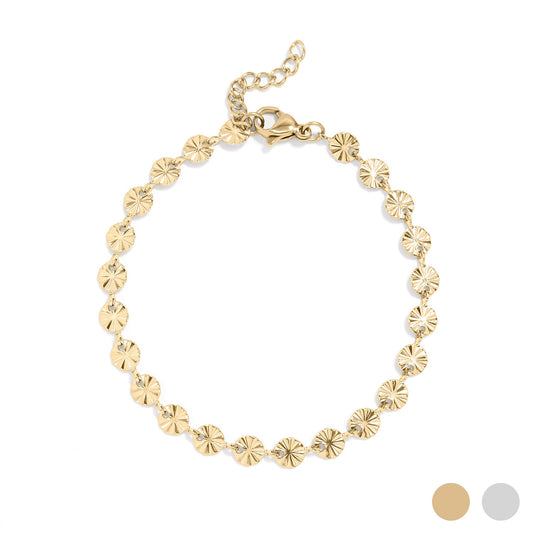 Gold bracelet with mini sun shapes on a white background