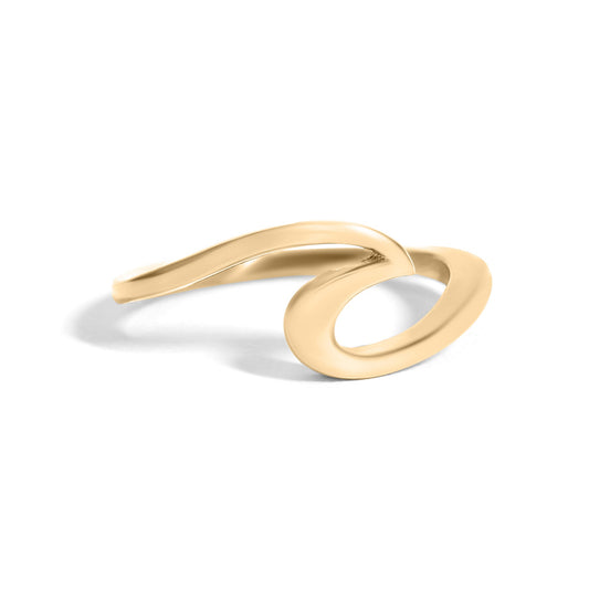 Gold ring with a ocean wave design on a white background