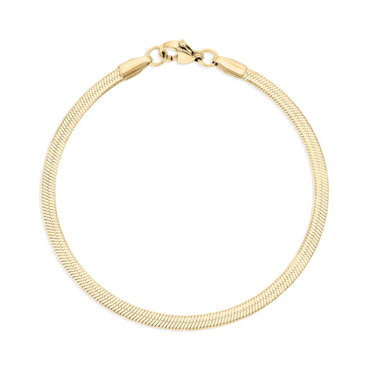 Gold herringbone bracelet on a white background