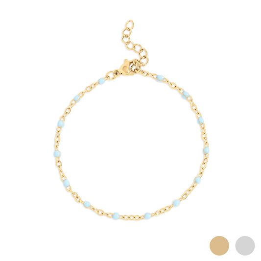 Gold bracelet with small turquoise beads on a white background