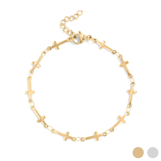 Gold bracelet with cross designs on a white background