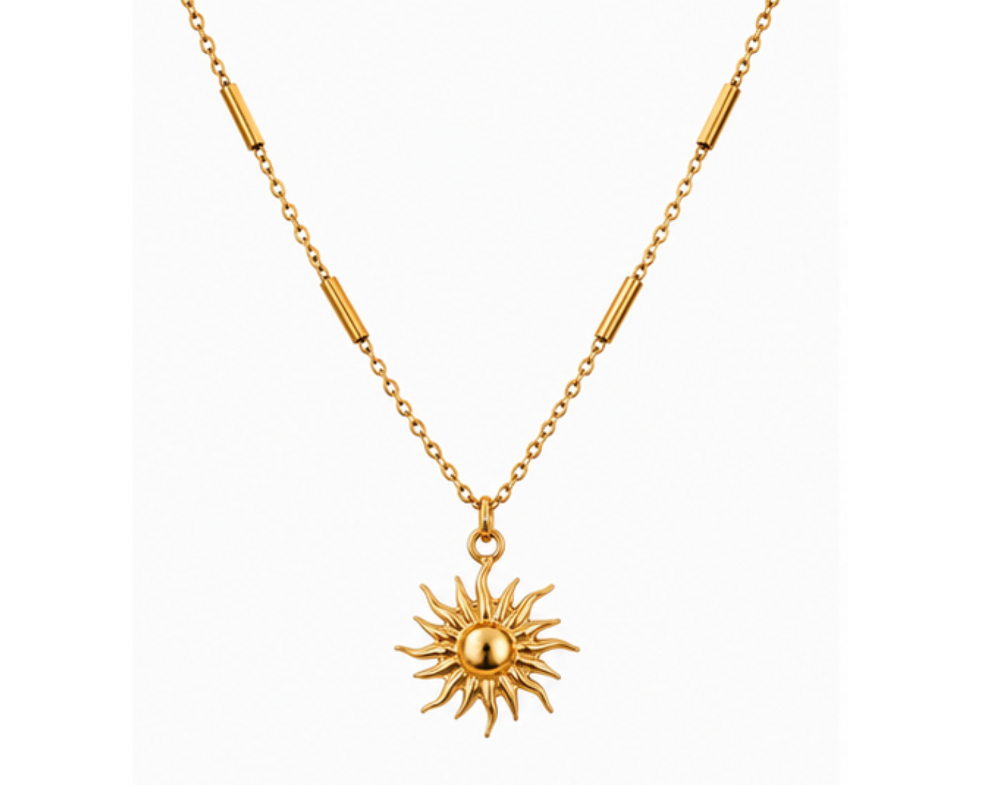 A gold bar station chain necklace featuring a central sunburst pendant with a polished gold center, displayed against a clean white background.