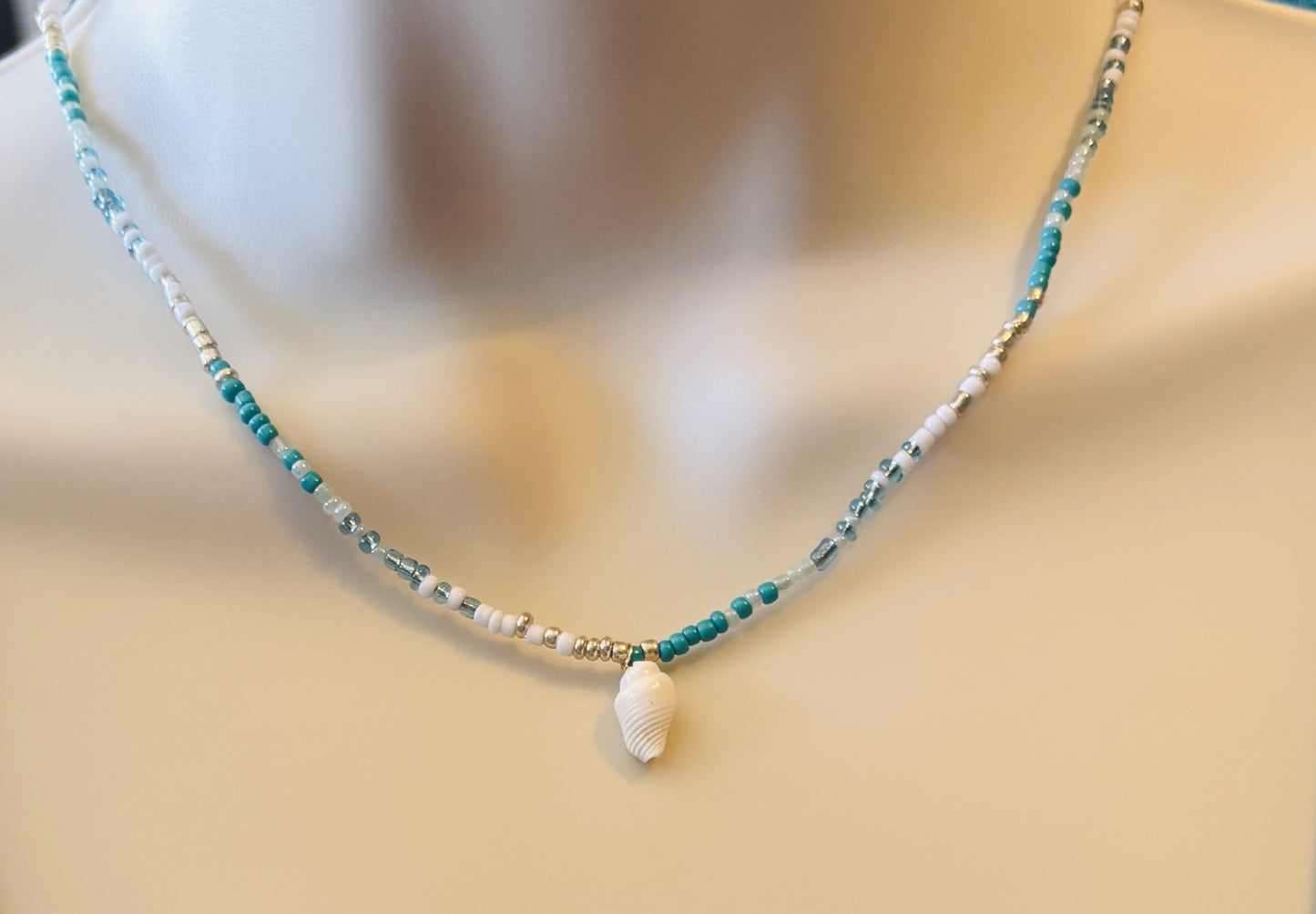 Necklace with shell pendant on a mannequin